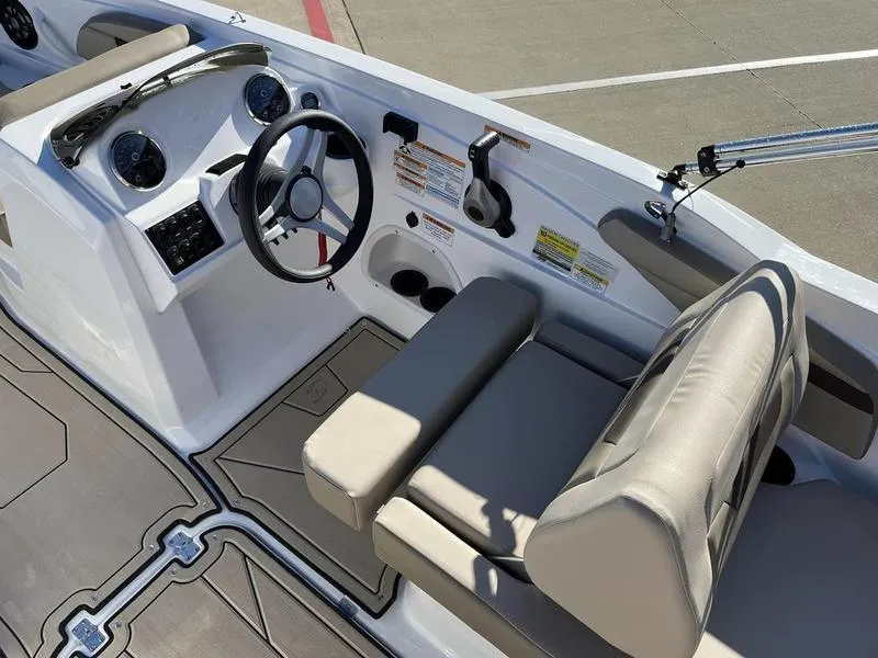 Slide: The Image of 2023 Hurricane SS205-OB boat cockpit with steering wheel and seating. - 16