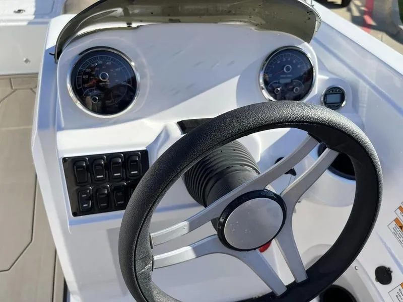 Slide: The Image of 2023 Hurricane SS205-OB boat dashboard with steering wheel and gauges. - 18