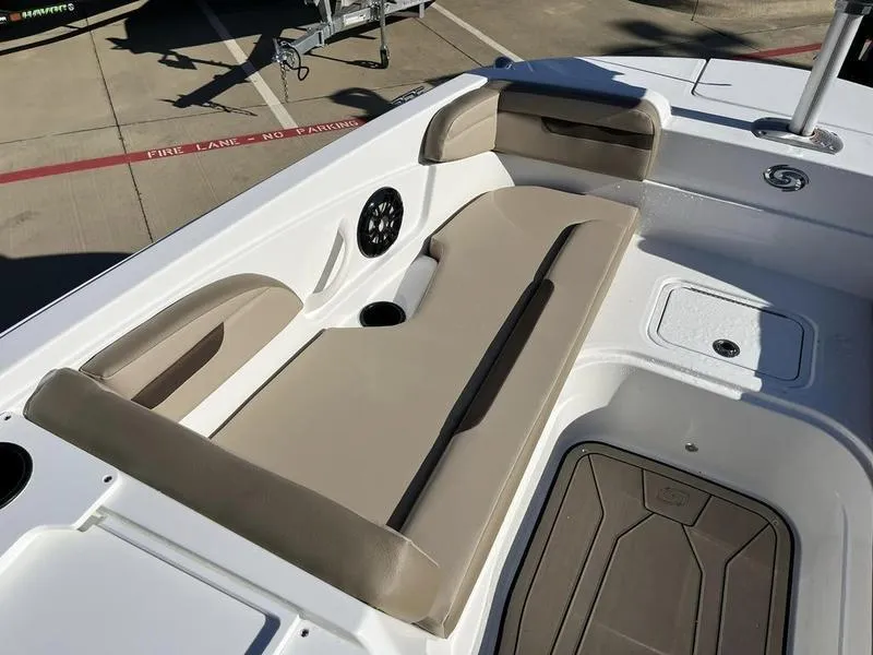 Slide: The Image of 2023 Hurricane SS205-OB boat interior with beige seating and cup holders. - 21