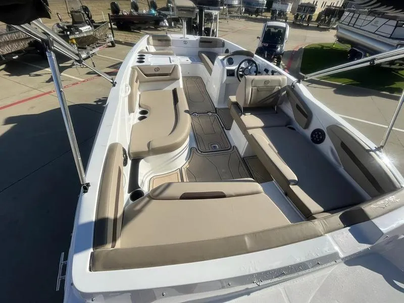 Slide: The Image of 2023 Hurricane SS205-OB boat interior with beige seating and modern design. - 7