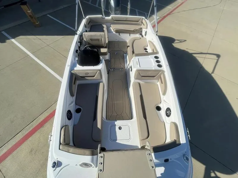 Slide: The Image of 2023 Hurricane SS205-OB boat interior with beige seating and spacious layout. - 9