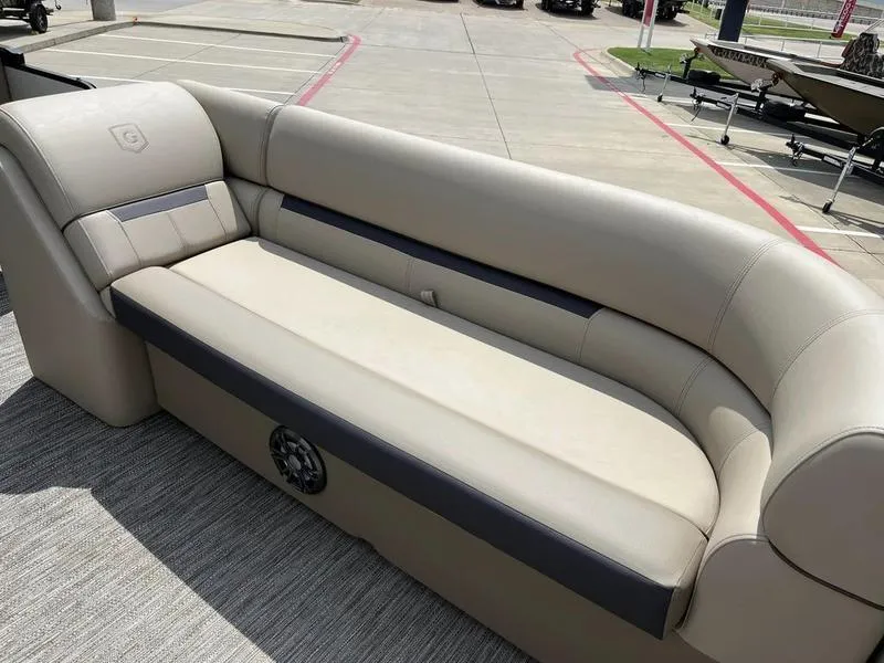 Slide: The Image of 2023 Godfrey Sweetwater 2286SB pontoon boat with beige seating in a parking lot. - 10