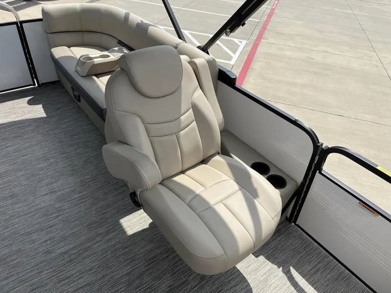 Slide: The Image of 2023 Godfrey Sweetwater 2286SB boat interior with beige leather seating. - 13