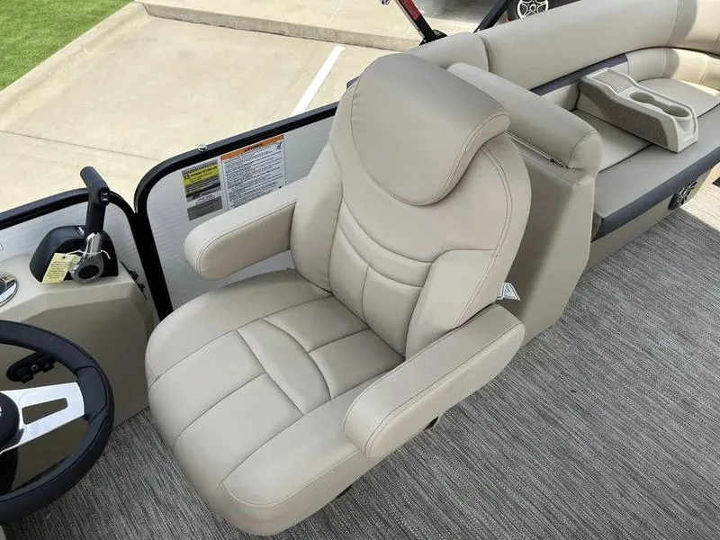 Slide: The Image of Captain's chair of 2023 Godfrey Sweetwater 2286SB pontoon boat, featuring beige upholstery. - 16