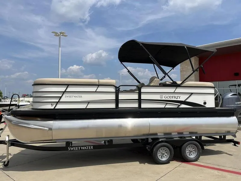 Slide: The Image of 2023 Godfrey Sweetwater 2286SB pontoon boat on trailer, outdoor display. - 8