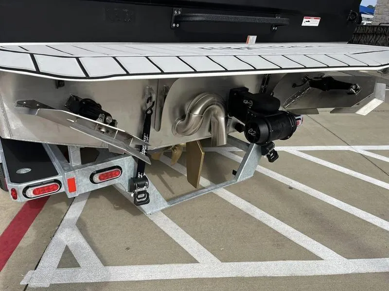 Slide: The Image of 2023 Montara Surf Boss boat rear view showing engine and trailer. - 10