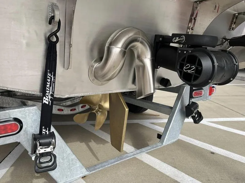 Slide: The Image of 2023 Montara Surf Boss boat propeller and exhaust system on trailer. - 11