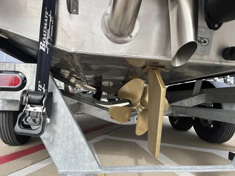 Slide: The Image of 2023 Montara Surf Boss boat propeller and exhaust on trailer. - 12