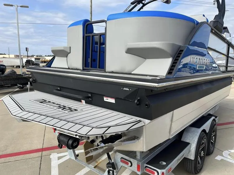 Slide: The Image of 2023 Montara Surf Boss boat on a trailer, rear view. - 13