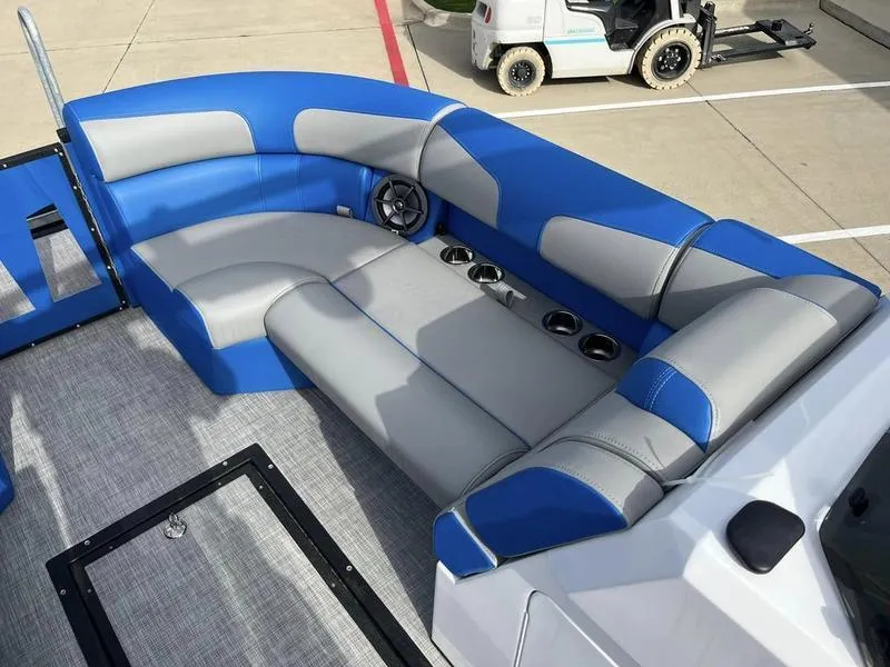 Slide: The Image of 2023 Montara Surf Boss boat with blue and gray seating, cup holders, and speaker. - 17