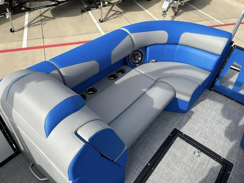 Slide: The Image of 2023 Montara Surf Boss boat interior with blue and gray seating. - 18