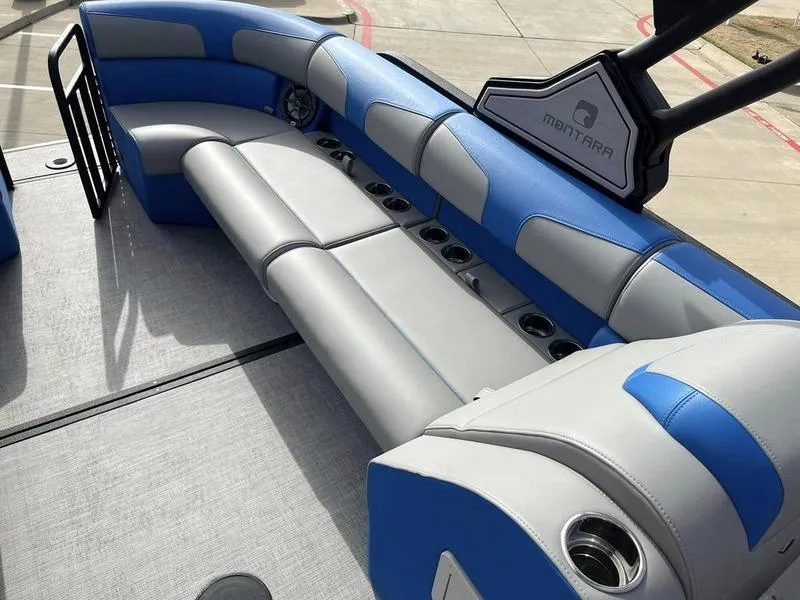 Slide: The Image of 2023 Montara Surf Boss boat interior with blue and gray seating. - 22