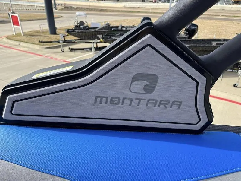 Slide: The Image of 2023 Montara Surf Boss boat detail with logo and blue upholstery. - 24