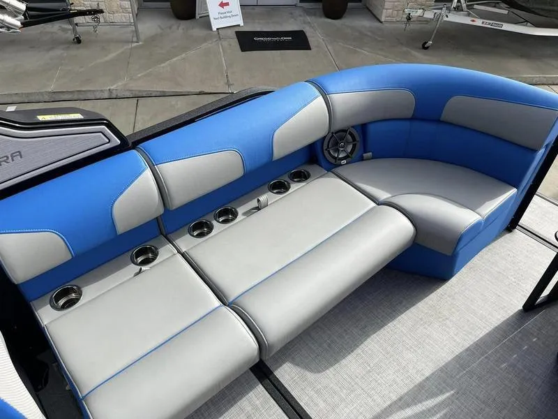 Slide: The Image of 2023 Montara Surf Boss boat interior with blue and gray seating and multiple cup holders. - 25