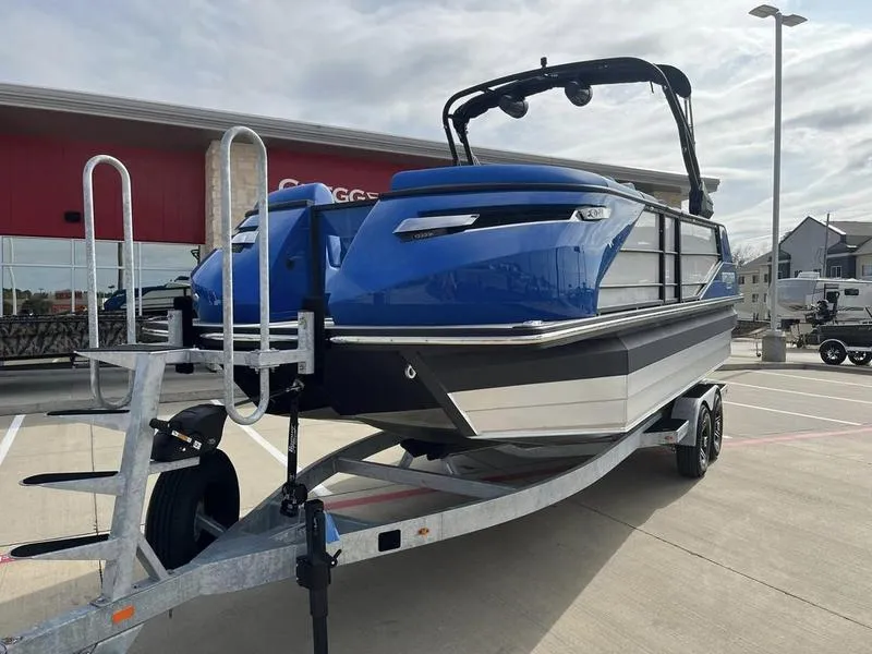 Slide: The Image of 2023 Montara Surf Boss boat on a trailer in a parking lot. - 3