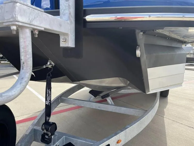 Slide: The Image of 2023 Montara Surf Boss boat on trailer, close-up of hull and trailer details. - 4