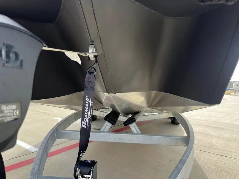 Slide: The Image of Close-up of 2023 Montara Surf Boss boat on a trailer with Boatmate strap. - 5