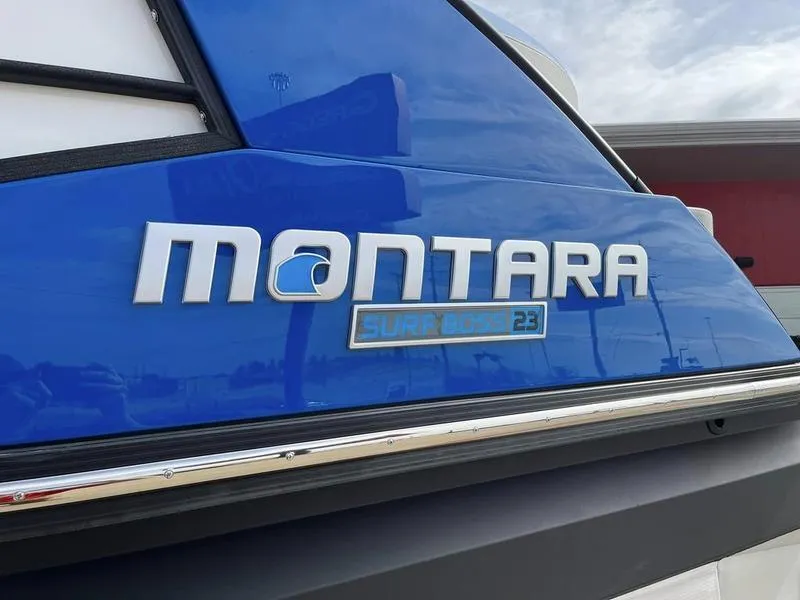 Slide: The Image of Montara Surf Boss 2023 boat logo on blue hull. - 8