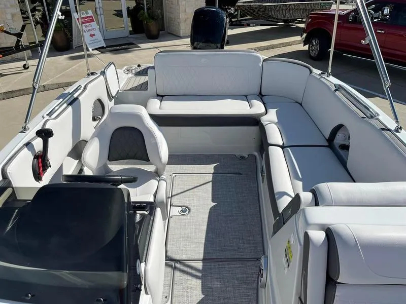 Slide: The Image of 2023 Crownline E205XS boat interior with spacious seating and modern design. - 16
