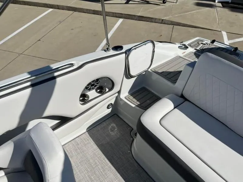Slide: The Image of 2023 Crownline E205XS boat interior with white seating and modern design. - 19