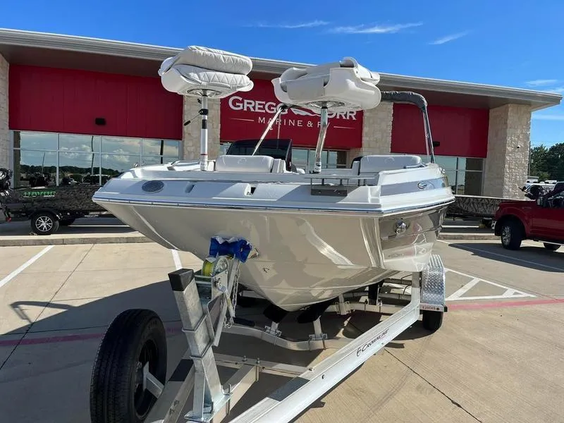 Slide: The Image of 2023 Crownline E205XS boat on trailer at dealership. - 3