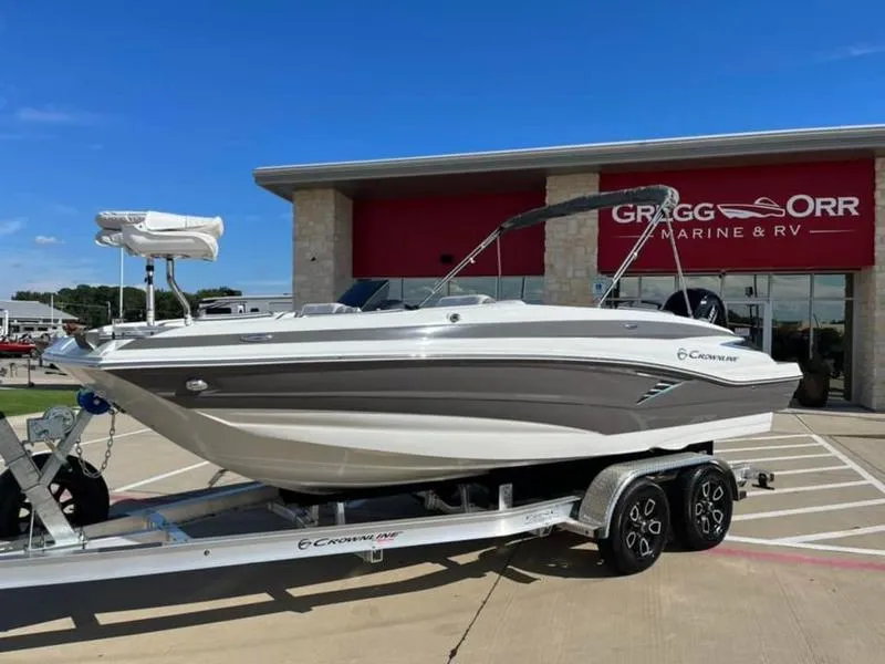 Slide: The Image of 2023 Crownline E205XS boat on trailer at dealership. - 4