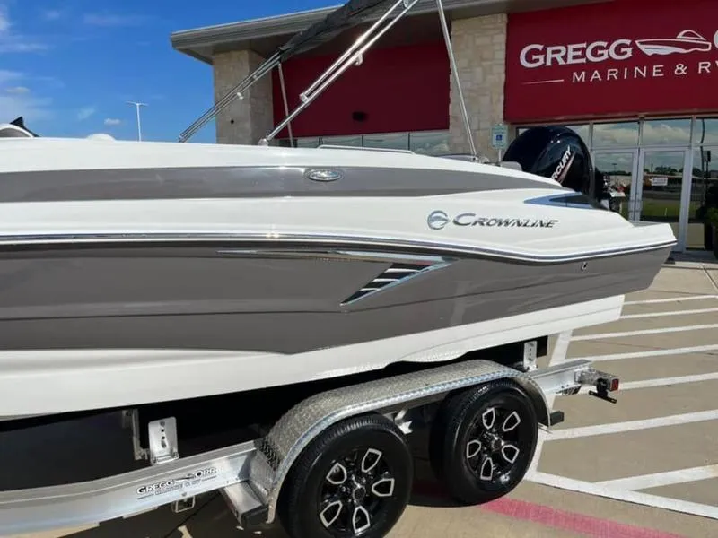 Slide: The Image of 2023 Crownline E205XS boat on trailer at Gregg Marine dealership. - 5