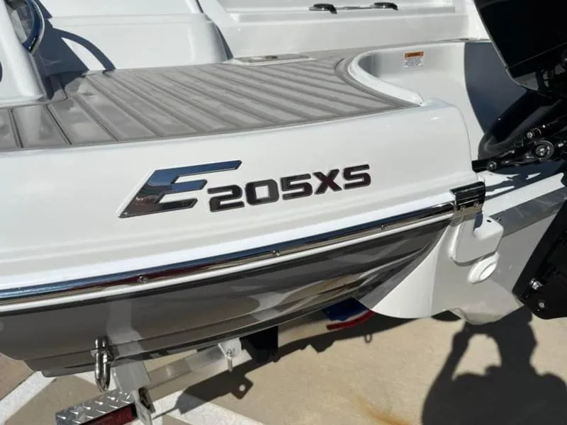 Slide: The Image of 2023 Crownline E205XS boat rear view with model name displayed. - 7