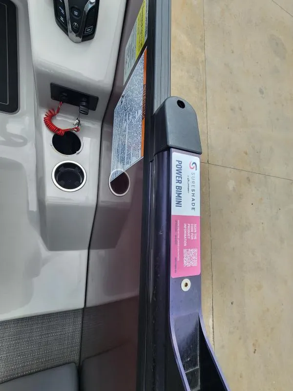 Slide: The Image of 2024 Starcraft SLS-5 Q DH boat interior with Power Bimini control panel. - 13