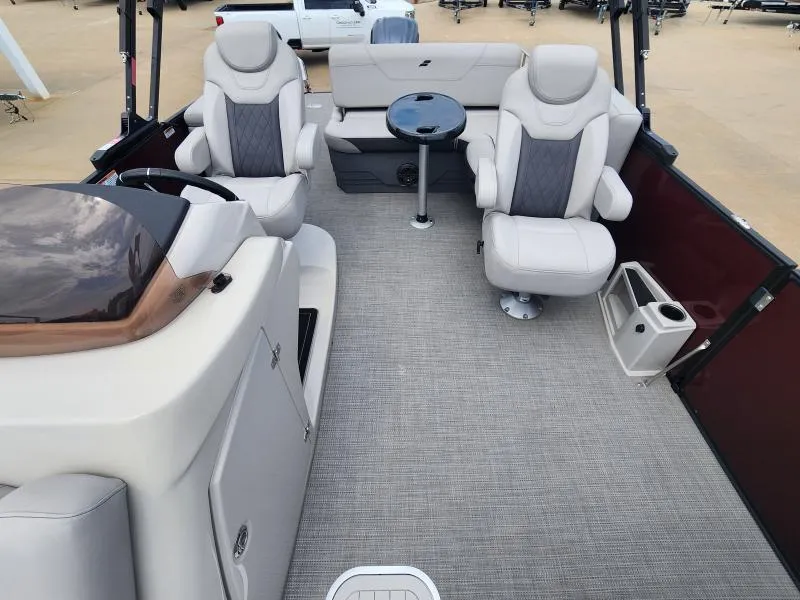Slide: The Image of 2024 Starcraft SLS-5 Q DH boat interior with plush seating and table. - 5