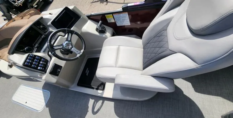 Slide: The Image of 2024 Starcraft SLS-5 Q DH boat cockpit with modern steering and controls. - 9