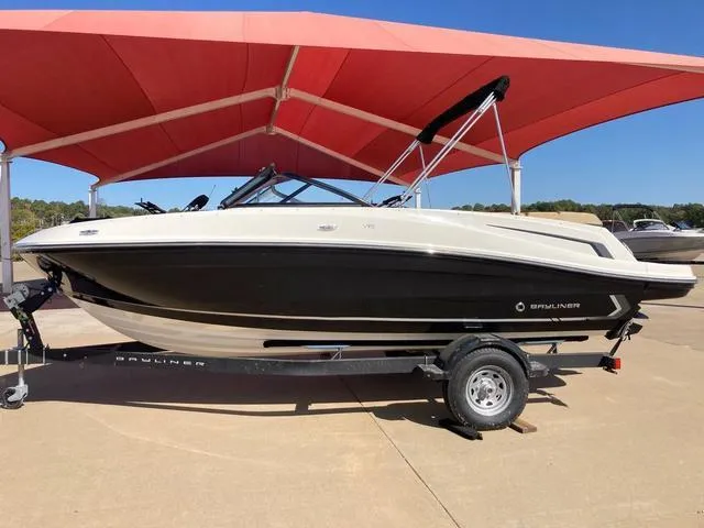Slide: The Image of 2023 Bayliner VR5 boat on trailer under red canopy. - 1
