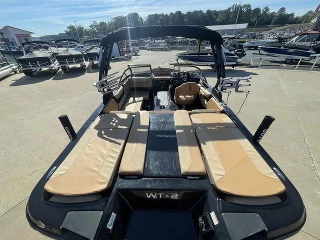 Slide: The Image of 2023 Heyday WT-2DC boat with tan seating at a marina. - 5