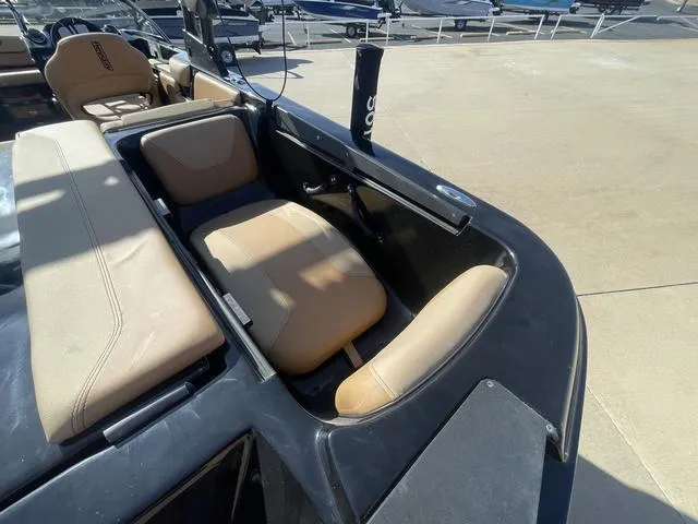 Slide: The Image of 2023 Heyday WT-2DC boat interior with tan seating and black trim. - 6