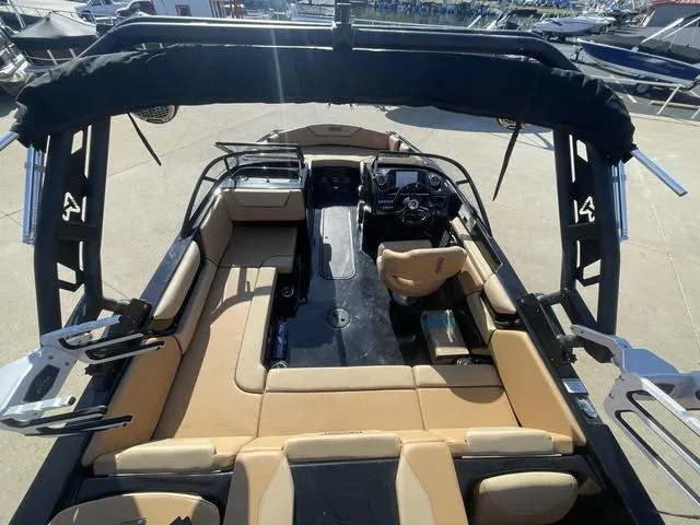 Slide: The Image of 2023 Heyday WT-2DC boat interior with tan seating and black accents. - 7
