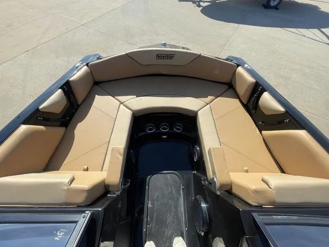 Slide: The Image of 2023 Heyday WT-2DC boat with spacious tan seating and cup holders. - 9