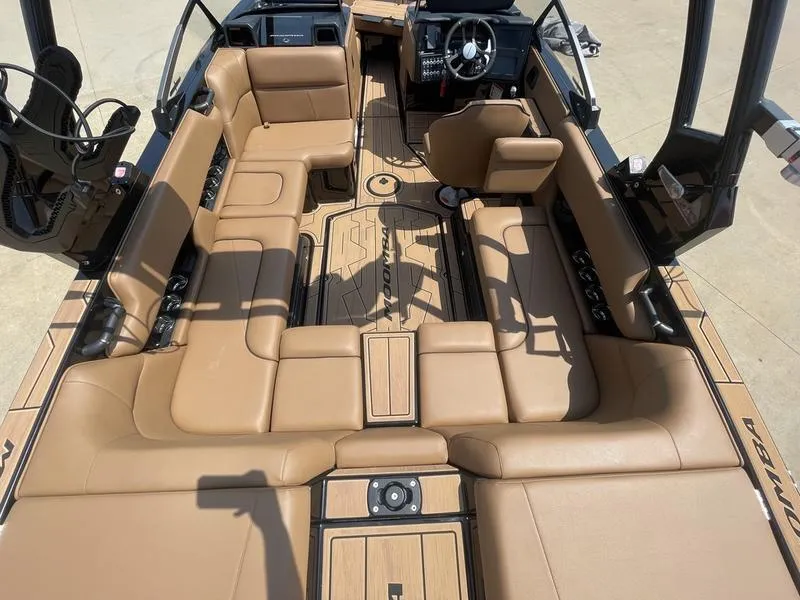 Slide: The Image of 2024 Moomba Craz boat interior with tan leather seating and modern dashboard. - 5