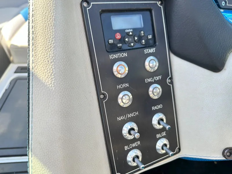 Slide: The Image of Control panel of a 2016 Centurion FS44 boat with various switches and buttons. - 15