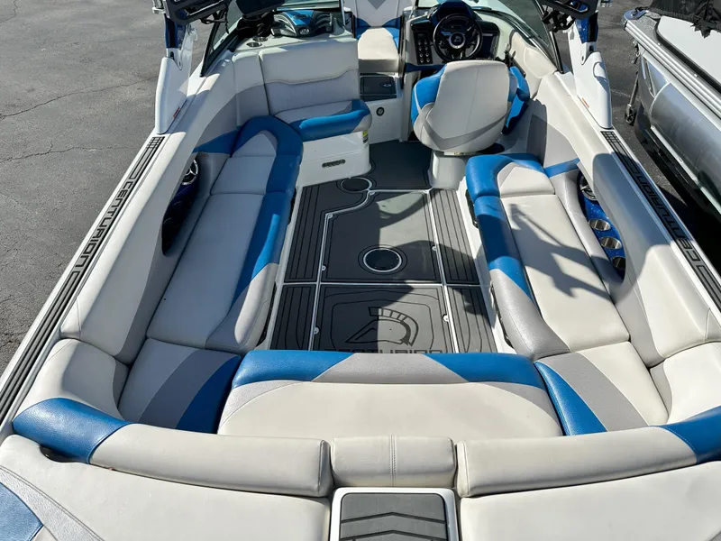Slide: The Image of 2016 Centurion FS44 boat interior with blue and white seating. - 4