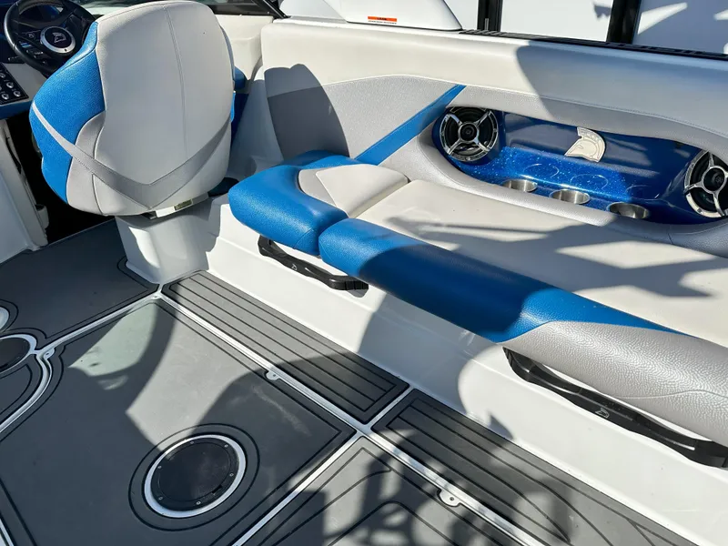 Slide: The Image of Interior of a 2016 Centurion FS44 boat with blue and gray seating. - 7