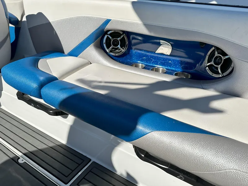 Slide: The Image of Centurion FS44 2016 boat interior with blue and white seating and built-in speakers. - 8