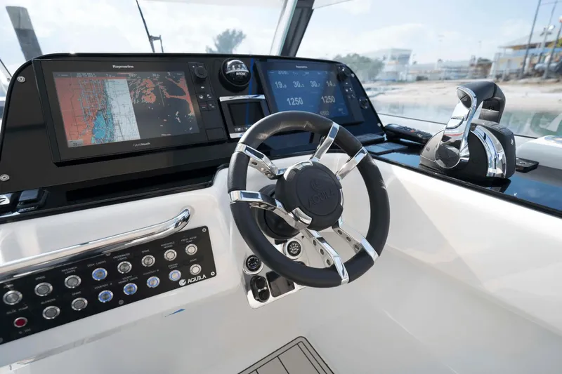 Slide: The Image of 2024 Aquila 36 Sport helm with advanced navigation and control systems. - 13