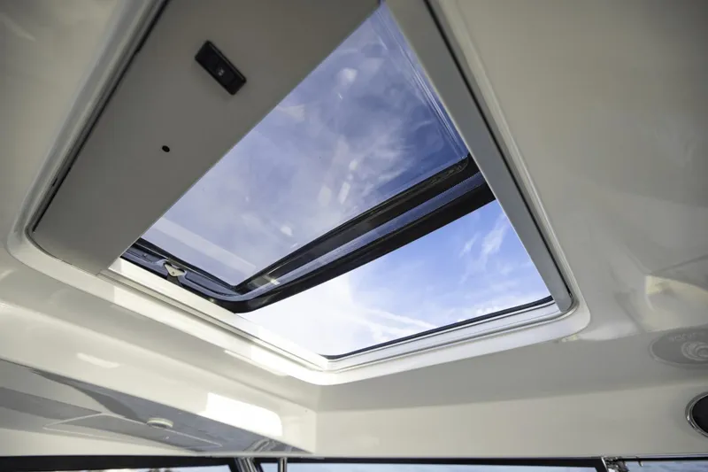 Slide: The Image of 2024 Aquila 36 Sport sunroof showcasing clear blue sky. - 15