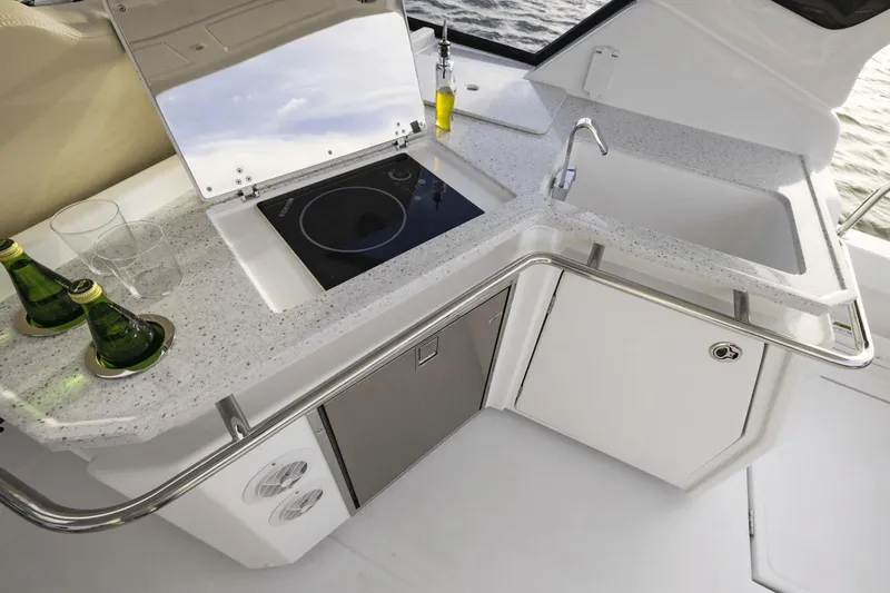 Slide: The Image of 2024 Aquila 36 Sport yacht kitchen with sink, stove, and countertop. - 17
