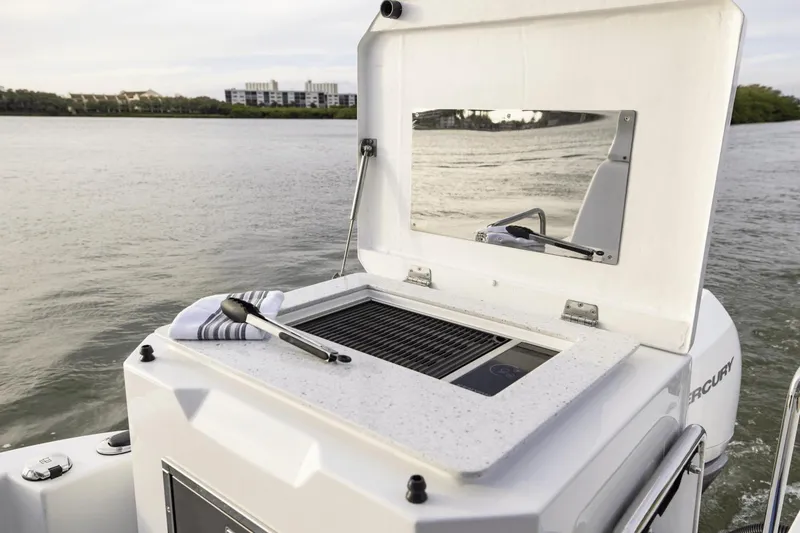 Slide: The Image of Aquila 36 Sport 2024 boat with outdoor grill and scenic water view. - 18