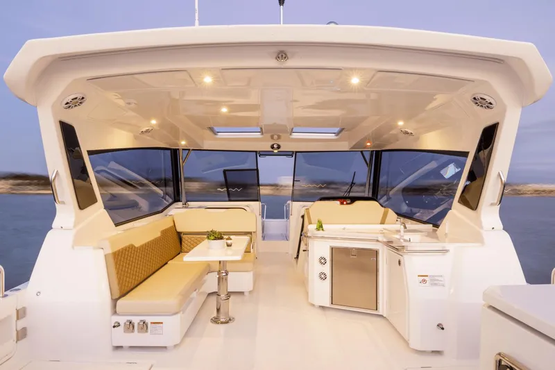 Slide: The Image of Luxurious 2024 Aquila 36 Sport yacht interior with seating and kitchenette. - 6