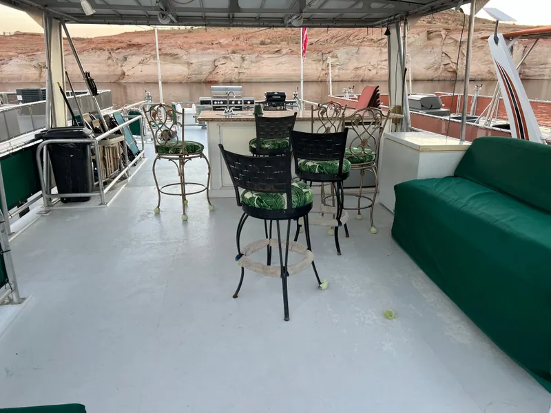 Slide: The Image of Upper deck of 1998 Custom Escalante share #8 houseboat with seating and bar area. - 24