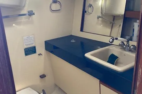 Slide: The Image of Bathroom interior of a 1985 Pearson 36-2 sailboat with sink and mirror. - 7