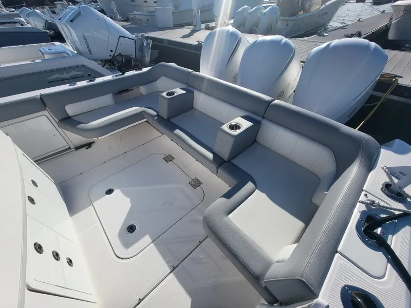 Slide: The Image of 2018 Everglades 360 LXC boat with spacious seating and cup holders. - 10
