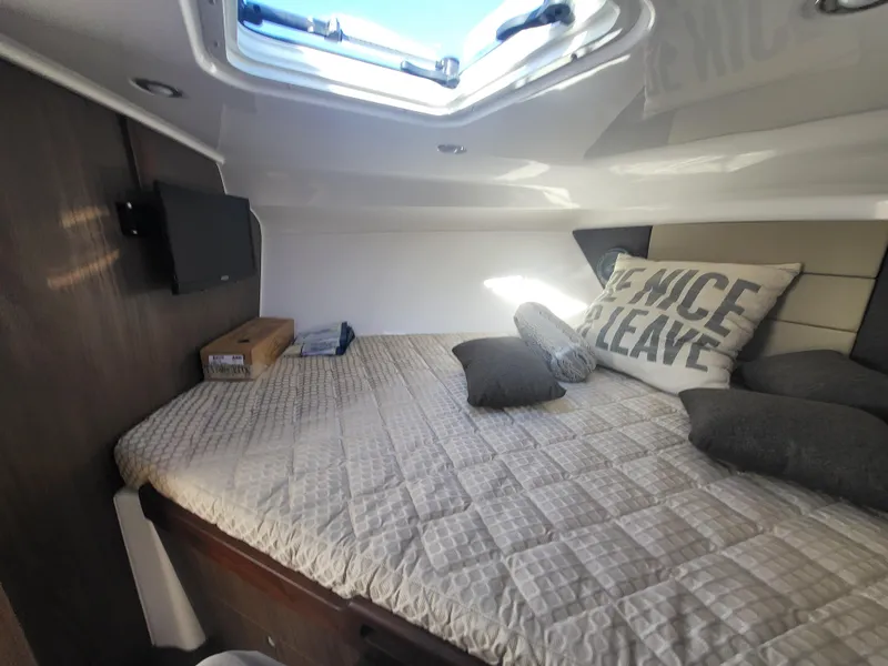 Slide: The Image of Cozy cabin interior of 2018 Everglades 360 LXC with bed, pillows, and skylight. - 22